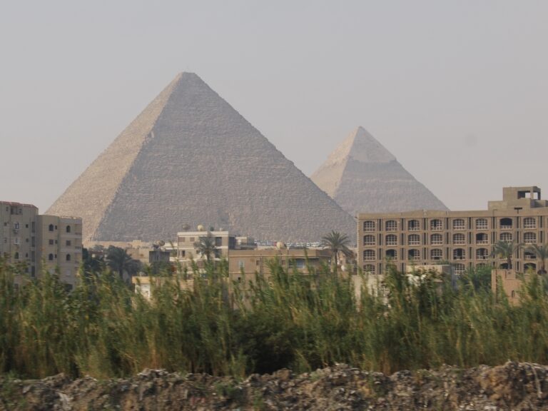 Pyramids of Giza glowing under desert sunset light, Egypt